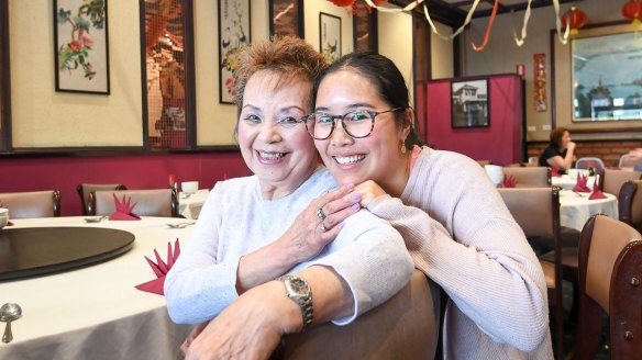 Maryanne, the wife of Jimmy Wong who has worked in the restaurant for 53 years, with her granddaughter Stephanie.