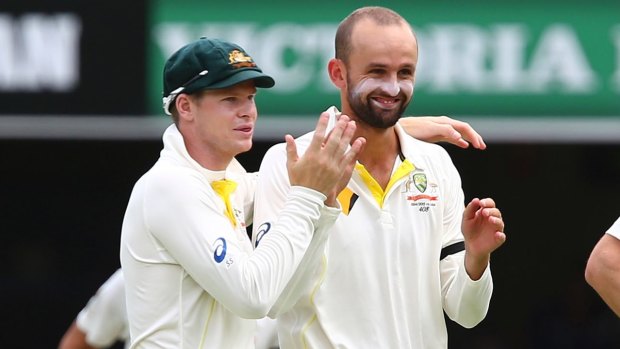 On-field relationship: Steve Smith and Nathan Lyon celebrate a wicket.