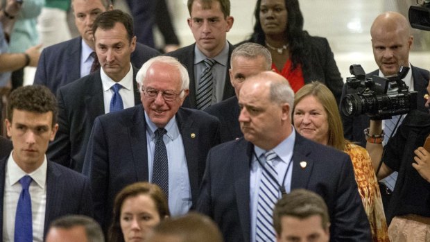 Senator Bernie Sanders, accompanied by his wife Jane, right, leaving a meeting with Hillary Clinton in Washington on Tuesday. 