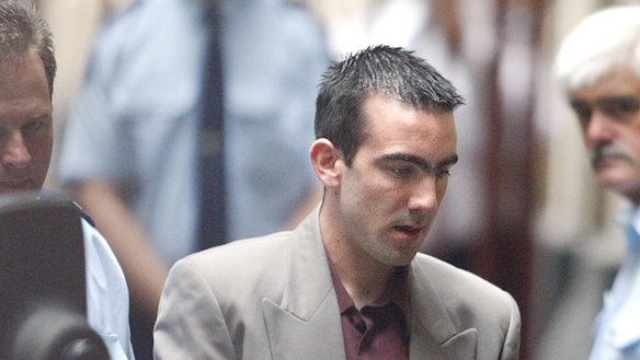  Jason Roberts is led handcuffed from a prison van at the Supreme Court on December 31, 2002