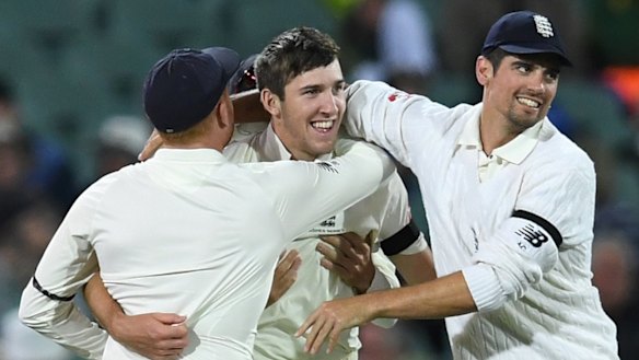 Milestone moment: Teammates congratulate debutant Craig Overton.