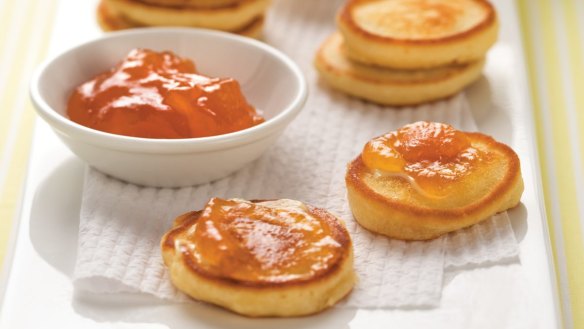 Serve the mini pancakes with jam.