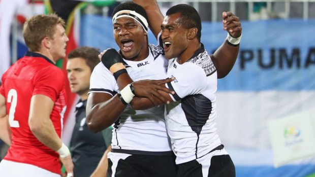 Viliame Mata and Ro Dakuwaqa celebrate as they win gold.