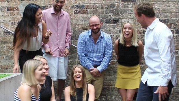 Recognised and rewarded employees are more productive: Jimmy Wright (centre) with the Red team in Sydney.