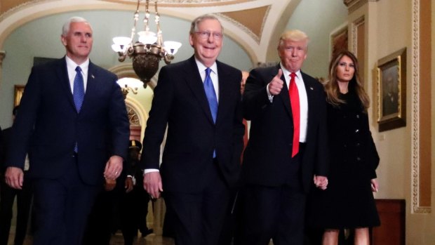 New era: Vice President-elect Mike Pence, Senate Majority Leader Mitch McConnell, President-elect Donald Trump and his wife Melania at Capitol Hill on Friday.