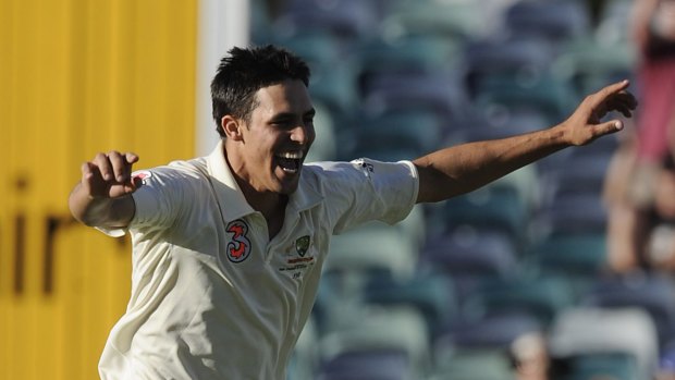 On fire: Mitchell Johnson claims the wicket of Morne Morkel.