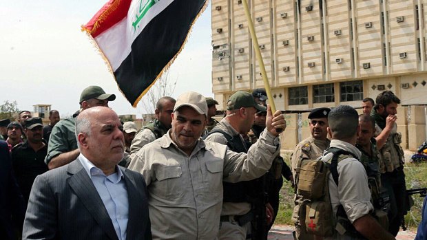 Iraqi Prime Minister Haider al-Abadi tours the city of Tikrit after it was retaken by the Iraqi security forces.