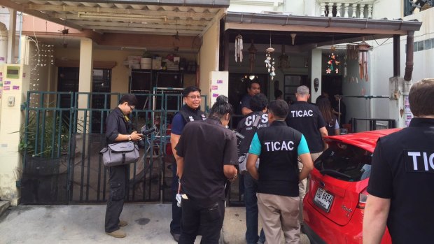 Police raid the home of Stephen Le Cornu in the Bangkok suburb of Bang Kapi on Tuesday.