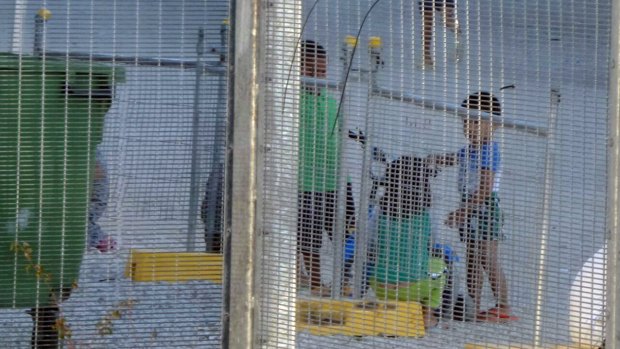 Children playing near the Refugee Processing Centre on Nauru.