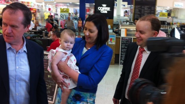 Opposition Leader Annastacia Palaszczuk, with federal counterpart Bill Shorten and Stretton candidate Duncan Pegg, delivers the first official baby cuddle of the Labor campaign to 12-month-old Larissa Soter of Sunnybank Hills.