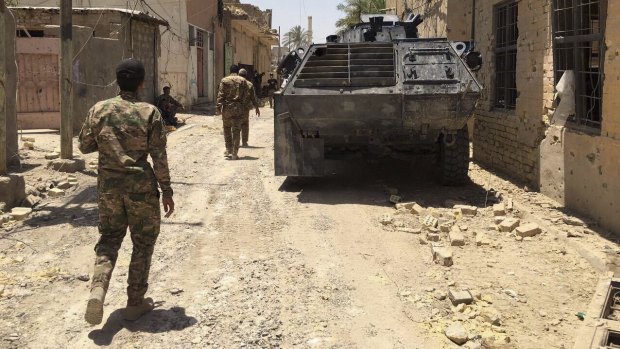 Iraqi security forces in Fallujah's  al-Julan neighborhood on Sunday after defeating Islamic State militants.