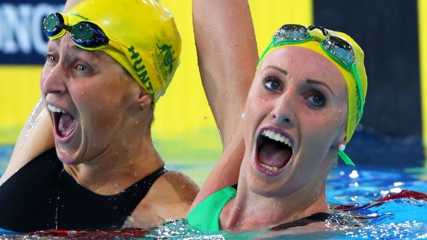 Taylor McKeown (R) of Australia celebrates winning the gold medal with silver medallist Sally Hunter.