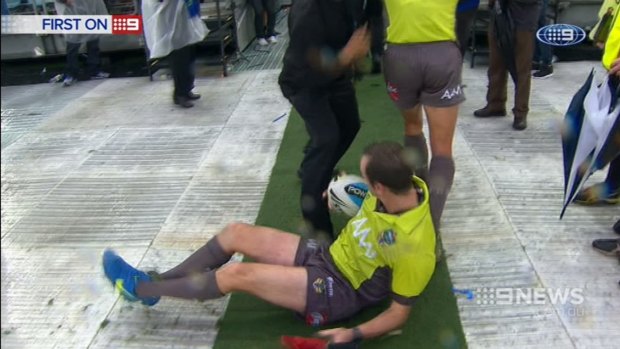 Club pays price for poor crowd behaviour: Linesman Nick Beashel hits the deck attempting to avoid a flying bottle.