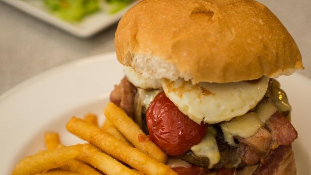 Terang Hotel's burger is so big we can only show you half of it.
