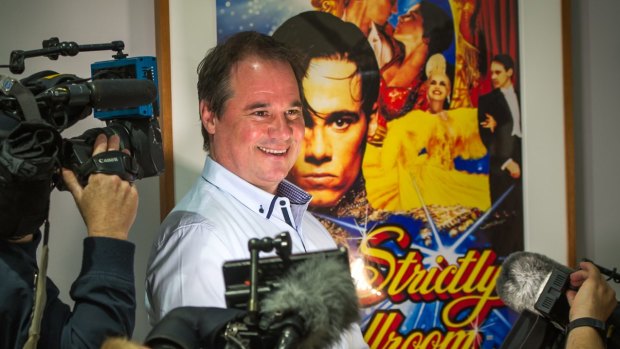 Shocked: Paul Mercurio with the poster for Strictly Ballroom at the launch of Starstruck: Australian Movie Portraits at the National Portrait Gallery. 