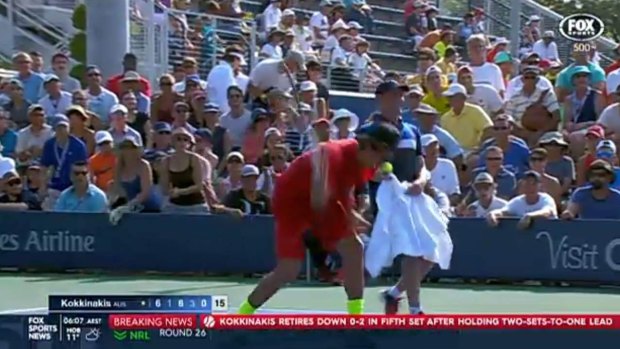 Thanasi Kokkinakis smashes his racquet.