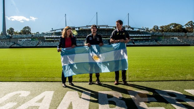 ACT minister for sport and recreation Yvette Berry and ARU general manager Rob Clarke with Tomas Cubelli at Canberra Stadium on Monday.