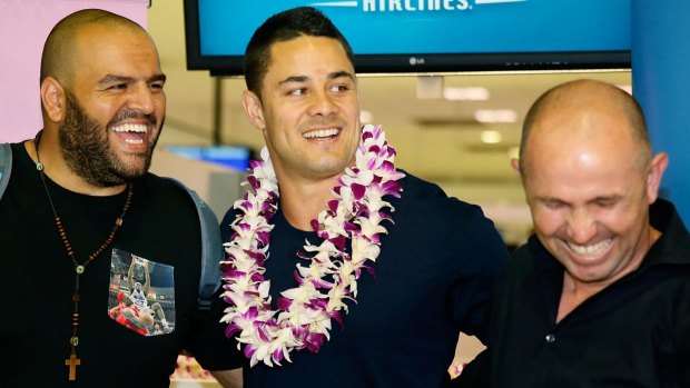 Friends in high places: Jarryd Hayne and co enjoy a lighter moment en route to the US.
