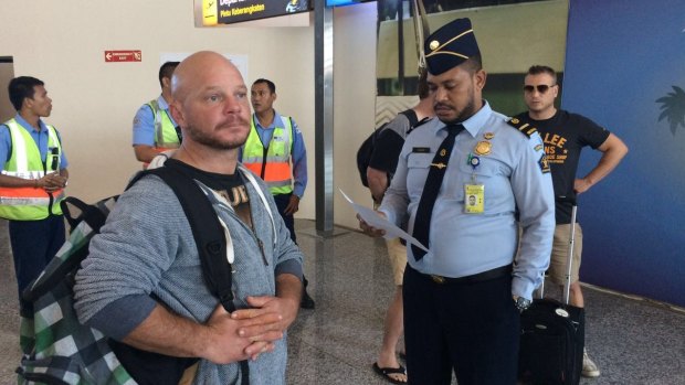 Ricky Longmuir waits to board his flight from Bali to Melbourne on Friday.