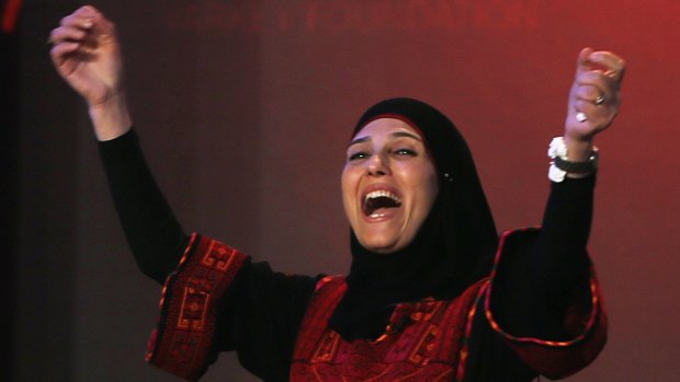 Palestinian primary school teacher Hanan al-Hroub reacts after winning the second annual Global Teacher Prize, in Dubai, on Sunday. Al-Hroub encourages students to renounce violence.