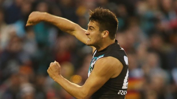 ADELAIDE, AUSTRALIA - AUGUST 04: (EDITORS NOTE: This is an alternative crop of the image #175480822.) Chad Wingard of the Power celebrates after he kicked a goal during the round 19 AFL match between the Adelaide Crows and Port Adelaide Power at AAMI Stadium on August 4, 2013 in Adelaide, Australia.  (Photo by Morne de Klerk/Getty Images)