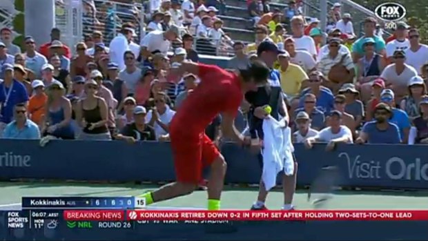 Thanasi Kokkinakis throws his racquet into the ground in frustration after cramp foiled a potential upset of Richard Gasquet.