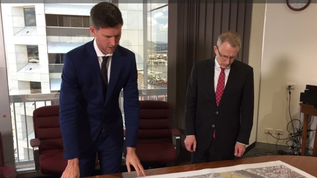 The long and the short of highway funding: Main Roads Minister Mark Bailey talks M1 funding with his federal counterpart, Urban Infrastructure Minister Paul Fletcher in Brisbane.
