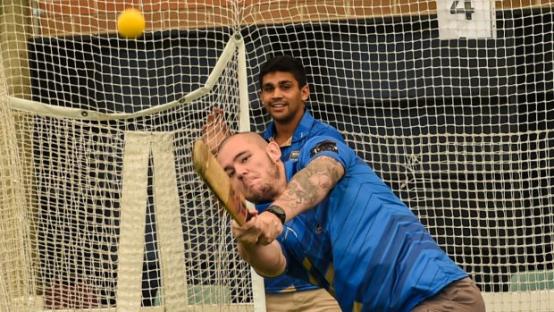 Hitting out: David Klemmer takes the long handle at the SCG indoor nets on Monday.