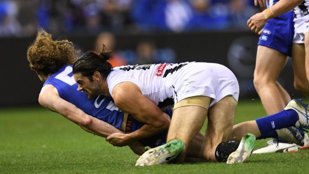 Ben Brown hit the turf head first in a tackle from Collingwood ruckman Brodie Grundy at Etihad Stadium on Saturday night.