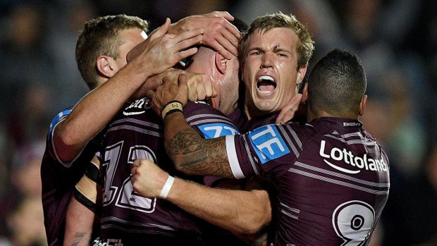 Fired up: Curtis Sironen celebrates with teammates after adding another four-pointer.