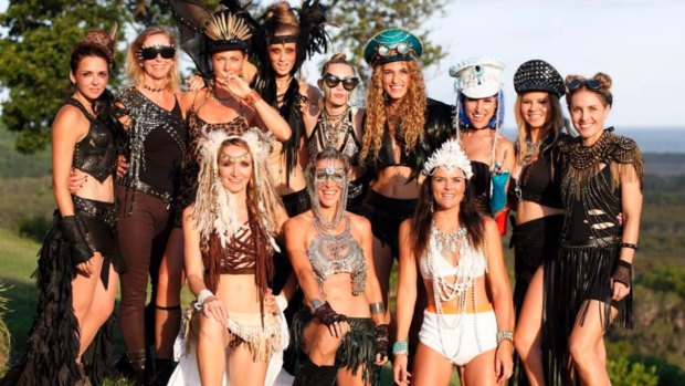 Miley Cyrus, centre back, and her crew on New Years Eve in Byron Bay.
