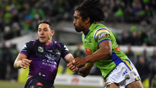 Nasty look for game: Billy Slater is knocked out by Iosia Soliola during the round-20 match between the Raiders and the Storm at GIO Stadium in Canberra.