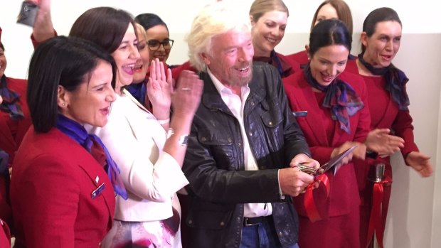 Sir Richard Branson celebrates opening the new Virgin Australia lounge with Qld Premier Annastacia Palaszczuk.
