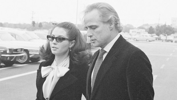 Anna Kashfi and Marlon Brando leave court in 1972 after testimony in a custody dispute over their son, Christian.