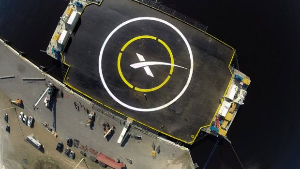 X marks the landing spot ... SpaceX's 
'autonomous spaceport drone ship', a landing barge which measures 91 by 52 metres with its 'wings' extended floats in the Atlantic Ocean east of Florida.