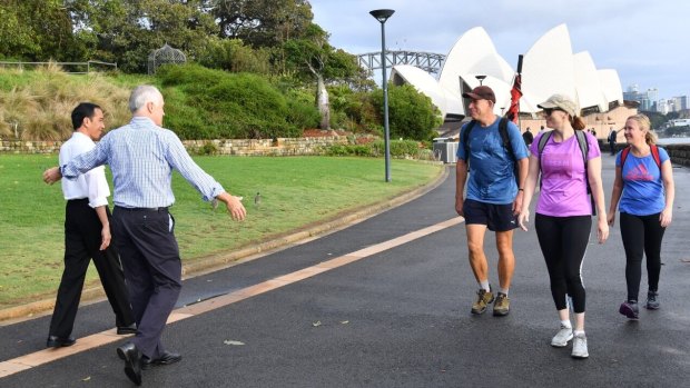 Indonesian President Joko Widodo and Prime Minister Malcolm Turnbull conduct "morning walk diplomacy" as they stroll through the Royal Botanic Garden in Sydney on Sunday.