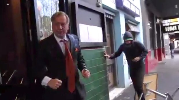 Andrew Bolt fights back against assailants on the streets of Carlton in Melbourne.