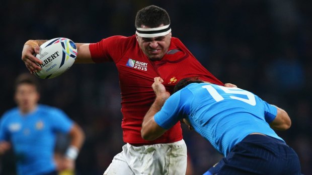 French charge:  Guilhem Guirado of France tries to break away from the tackle of Luke McLean of Italy.