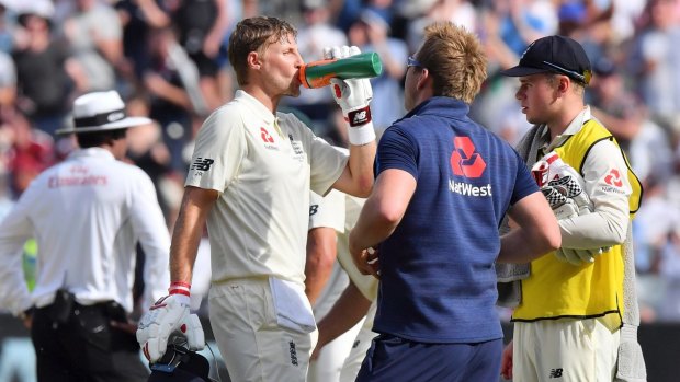 Safety first: Joe Root hydrates during one of the many drinks breaks on day four of the Test played in extreme heat.