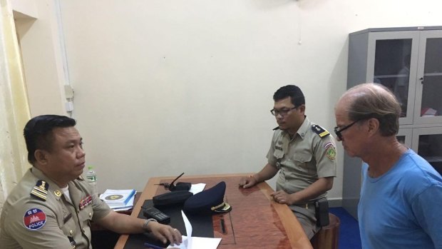 Australian filmmaker James Ricketson in police custody in Phnom Penh.