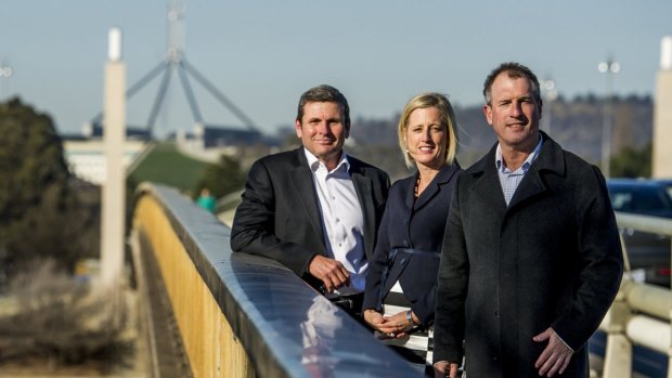 Authors and journalists Chris Uhlmann and Steve Lewis with Chief Minister Katy Gallagher on Commonwealth Bridge where a mini-series based on their books will be shot.