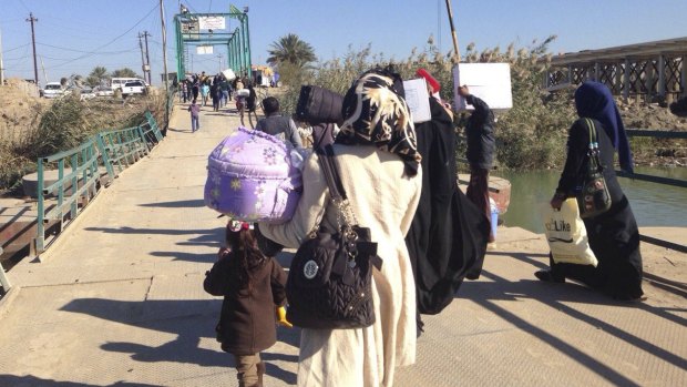Displaced civilians from Ramadi  flee towards Baghdad on Monday.