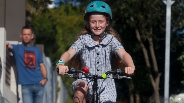 Macy will have to stop riding on the footpath when she turns 12 under NSW law.