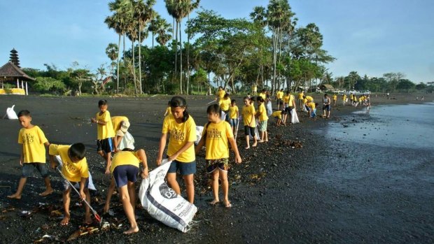 Volunteers from Trash Hero cleaning up rubbish on Bali beaches. 