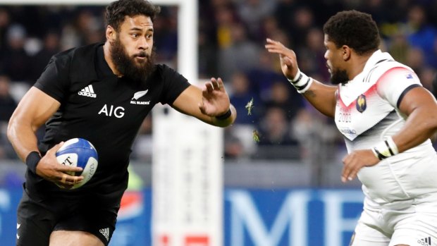 Patrick Tuipulotu of the All Blacks holds Jonathan Danty of France.