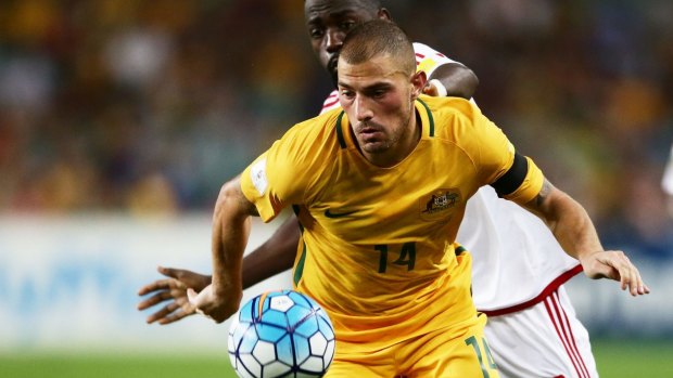James Troisi is challenged by Ahmed Barman in the Socceroos' World Cup qualifier against the UAE.