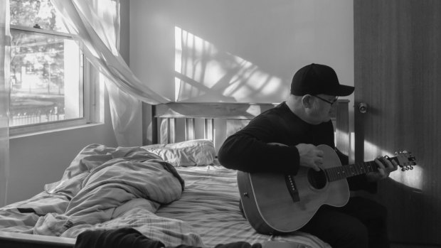 Perry Keyes is most comfortable sitting on his bed writing songs.