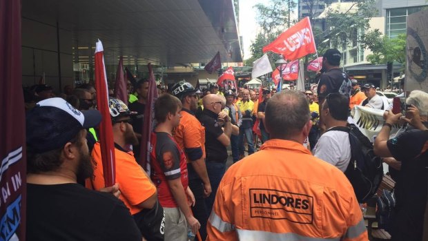 Union members protest the replacement of Australian shipping workers in Albert St, Brisbane.