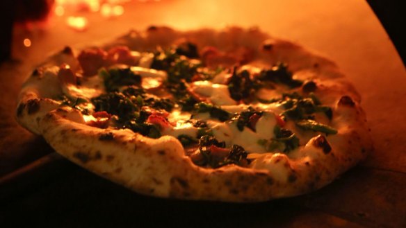 A wood-fired traditional pizza leaves the oven at Matteo's Restaurant at Double Bay.