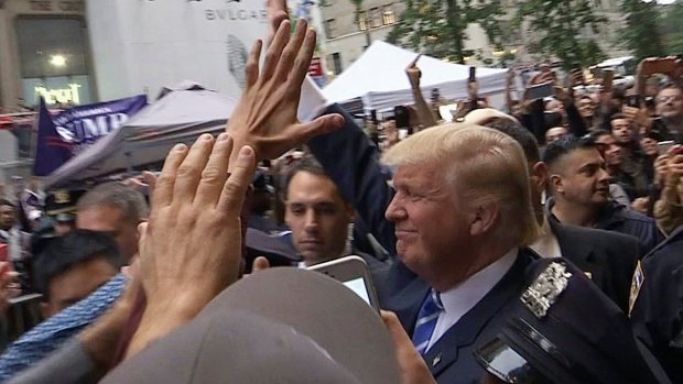Donald Trump leaves Trump Tower on Saturday, insisting he "would never" abandon his White House bid.